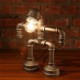 Robots conduit desk lamp